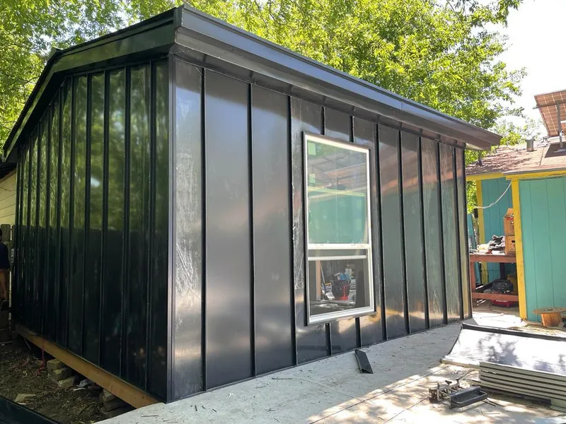 Black standing seam metal wall panels for Roof Inspection in Saraland